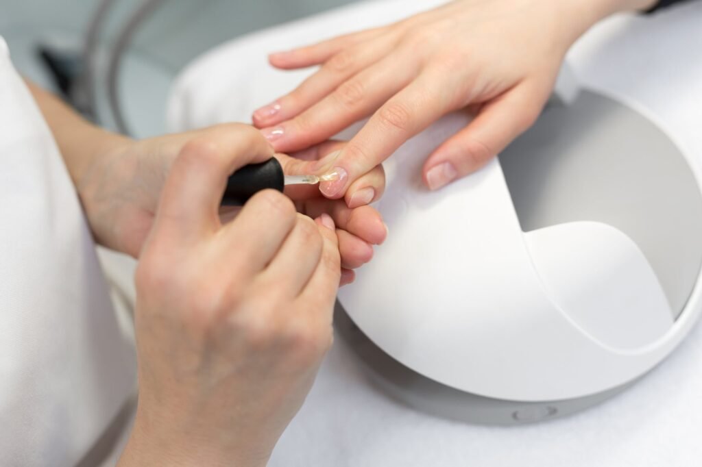 Gel polish being painted on nails