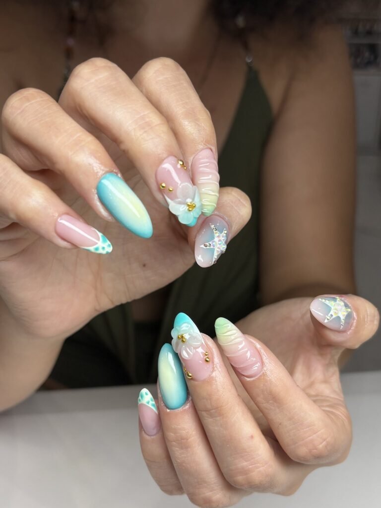 3D ocean nail art with seashells and pearls at Nailbox Co.