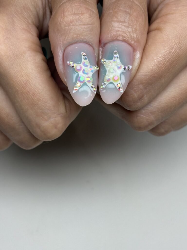 3D starfish nail art on almond nails at Nailbox Co.