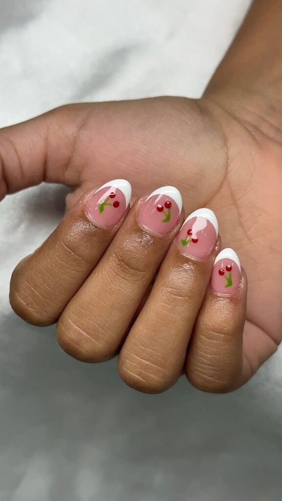 White French tips with hand-painted cherries at Nailbox Co.
