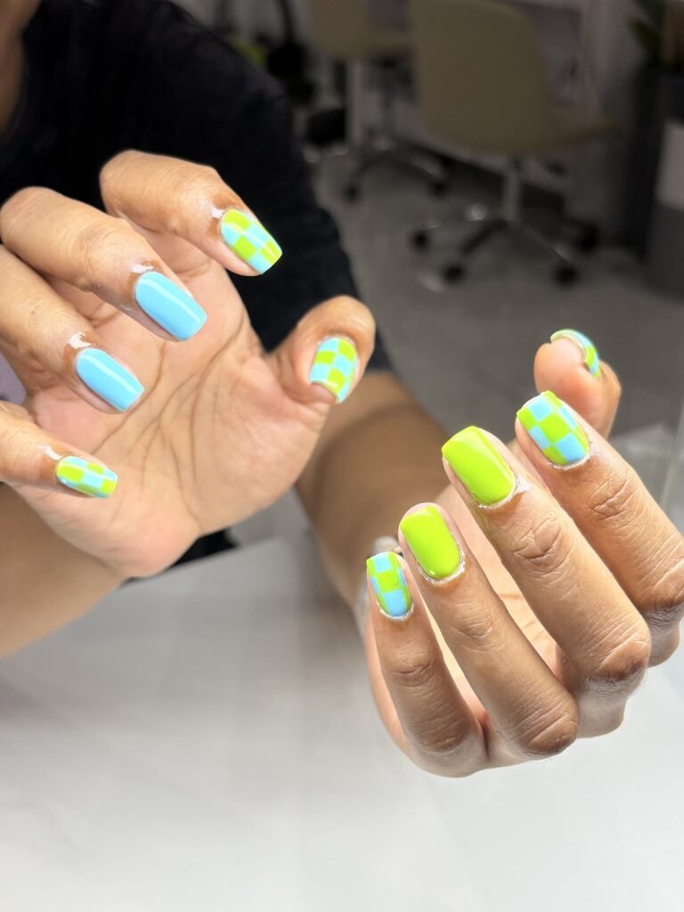Neon green and baby blue checkerboard nail art at Nailbox Co.