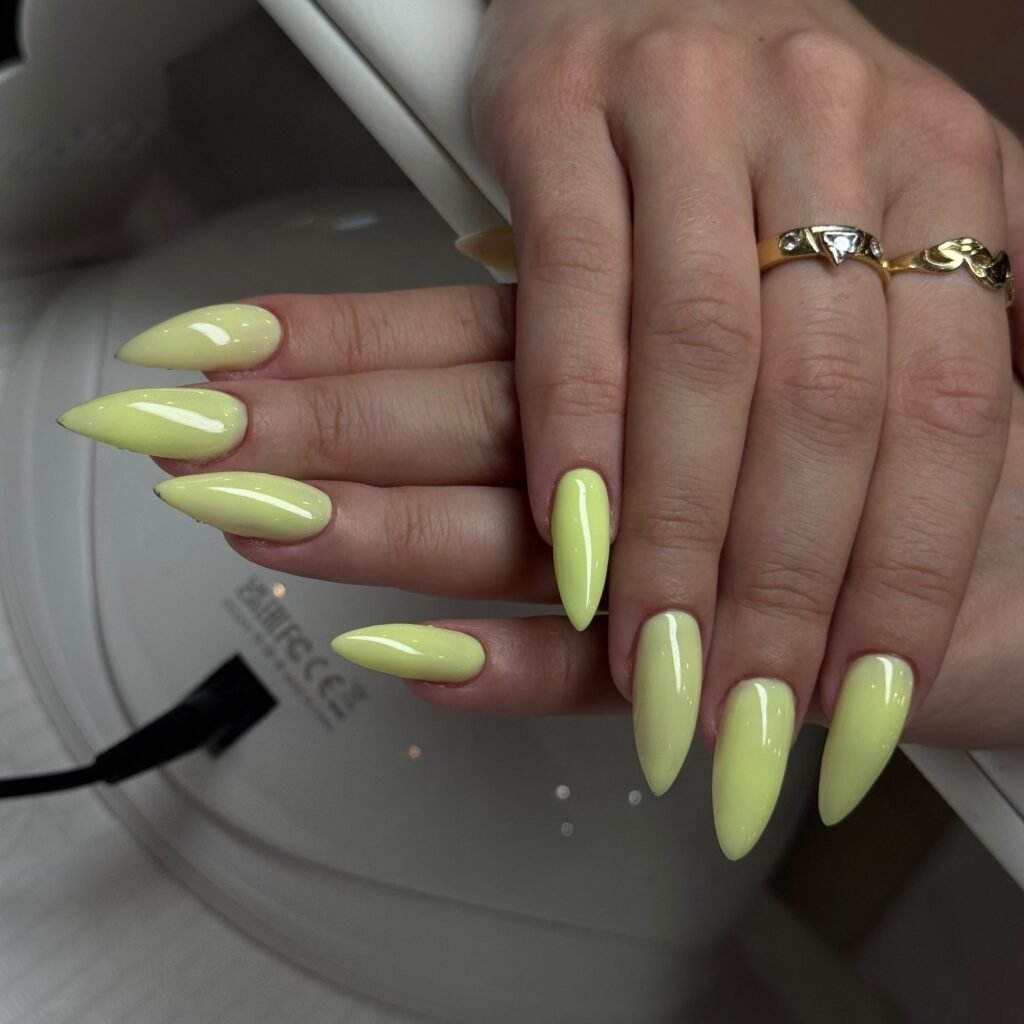Long almond nails in pistachio green gel at Nailbox Co.