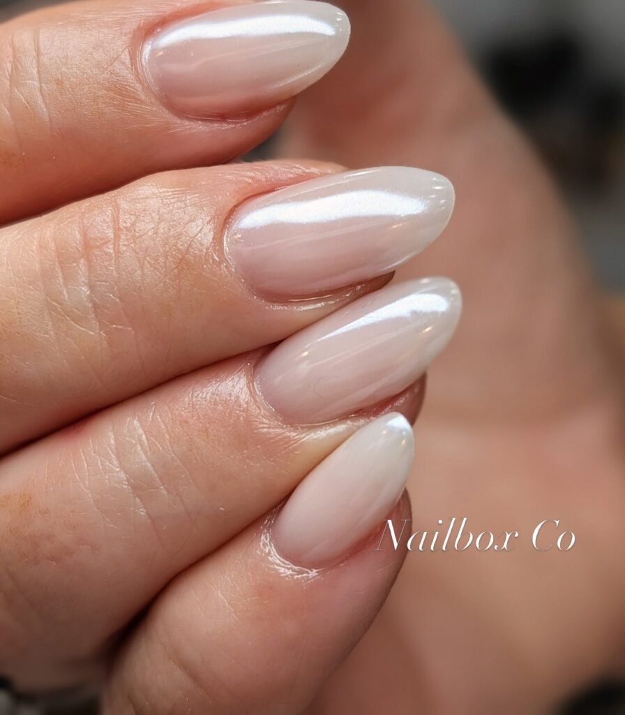Milky pearl Russian manicure on almond nails at Nailbox Co.